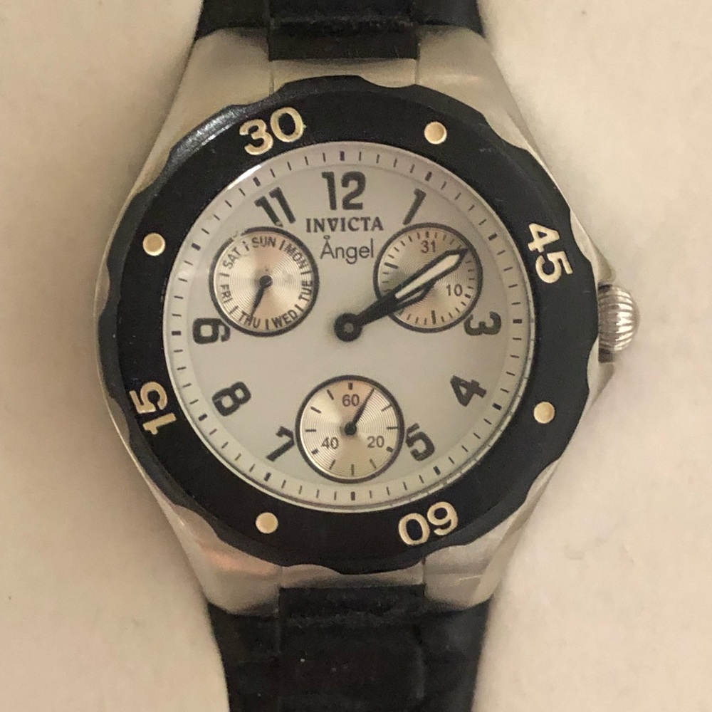 Invicta angel watch in its original wooden box.